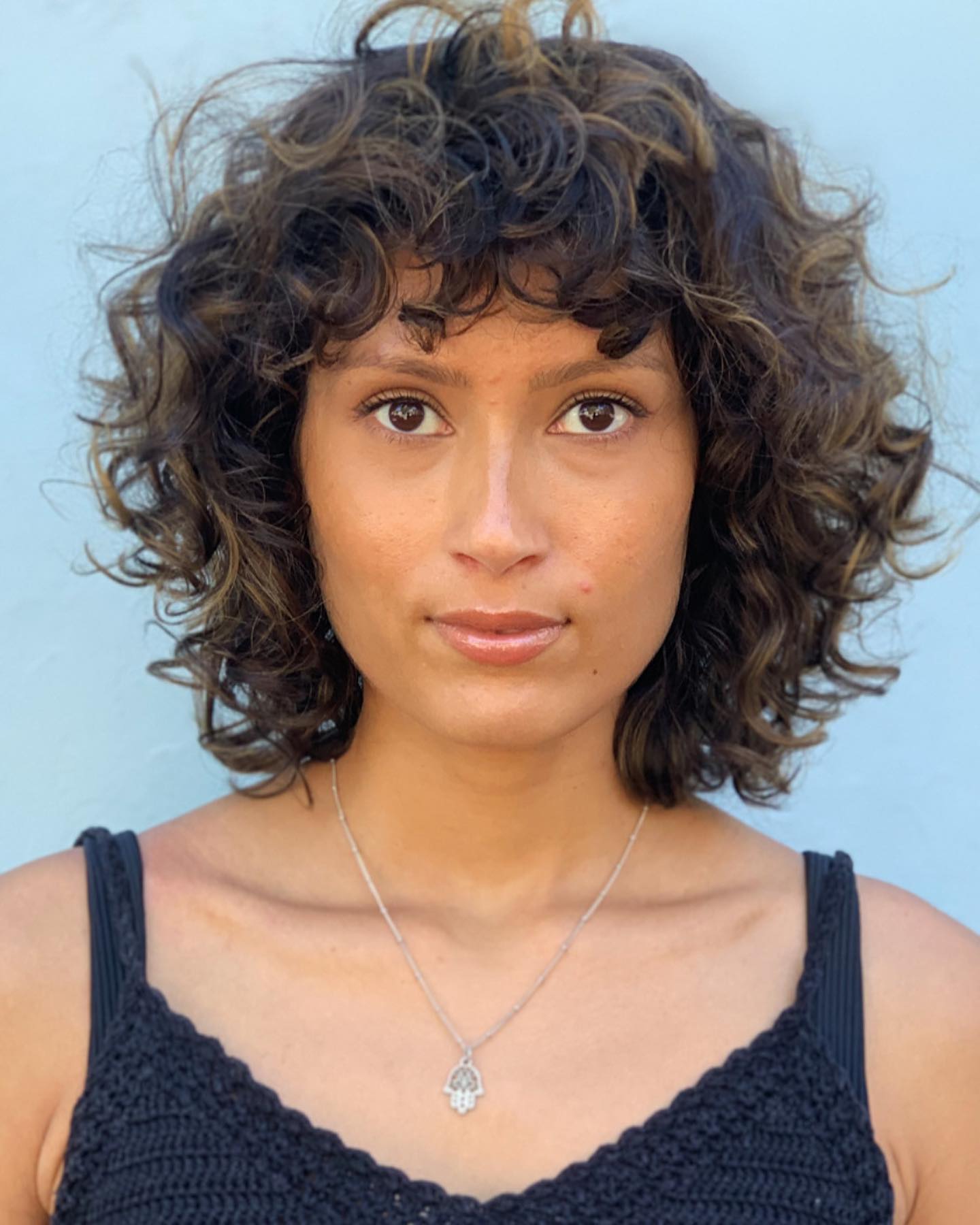 Curly Bob Cut with Thick Bang on Dark Hair