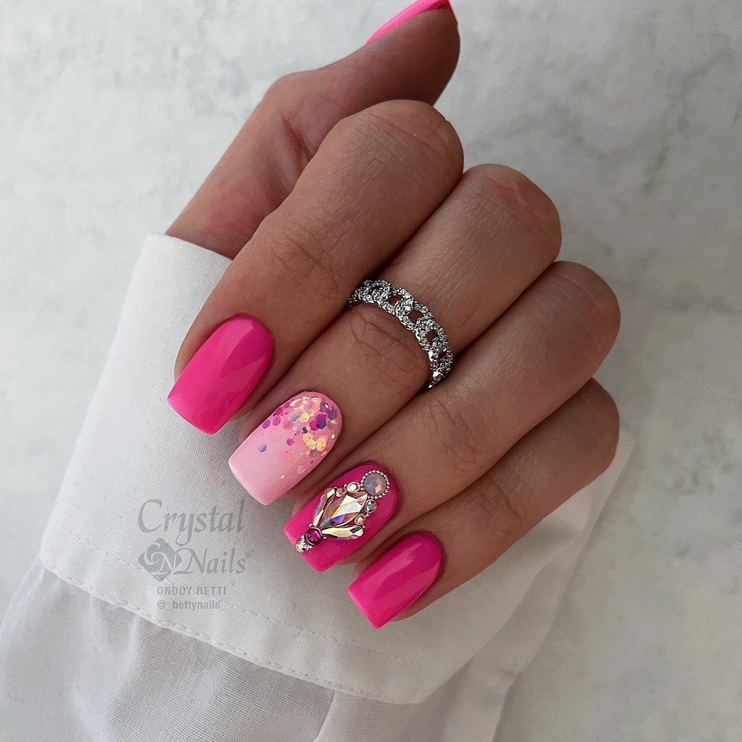 hot pink nails with gold glitter