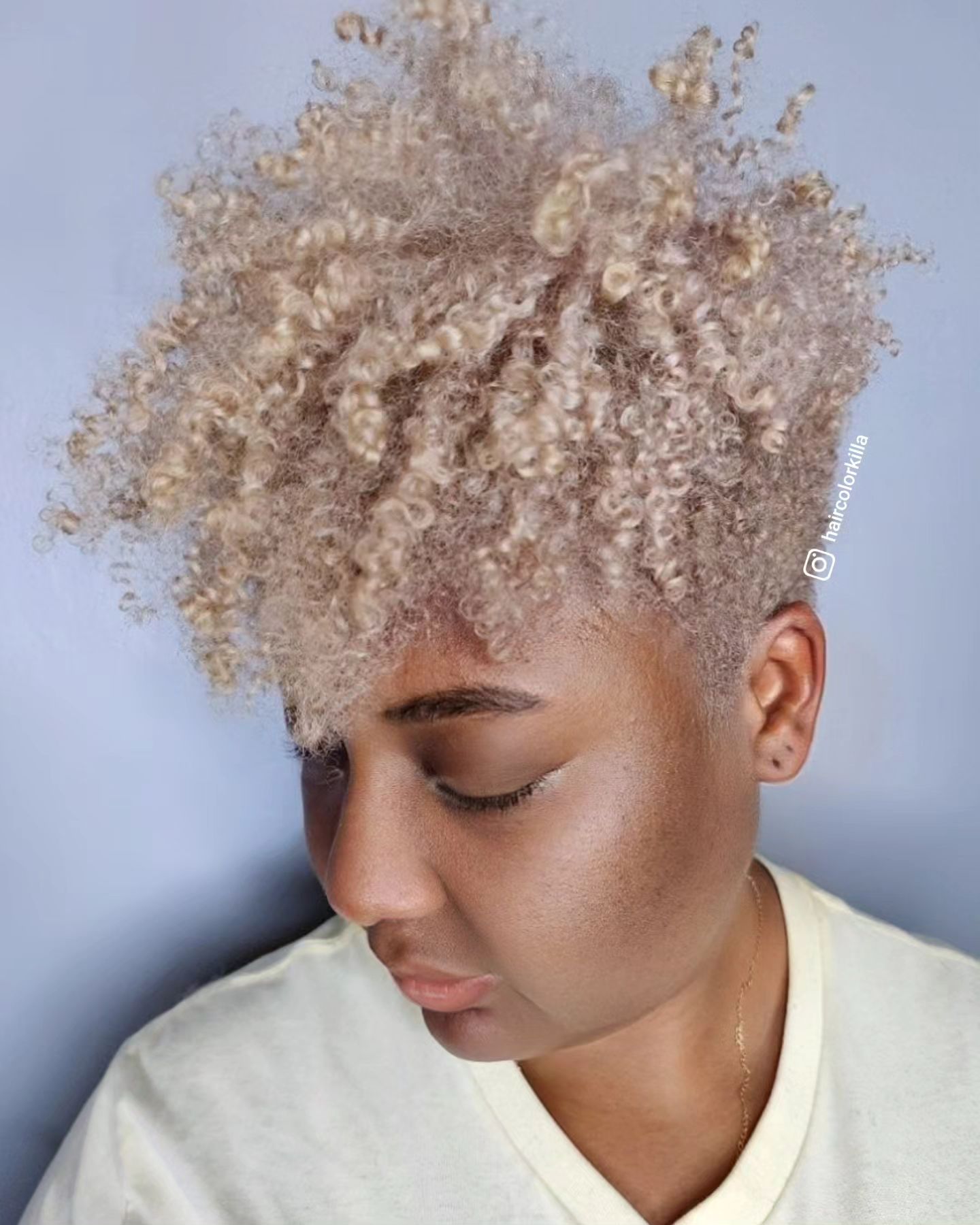 Short Curly Blonde Hair on Dark-Skinned Woman