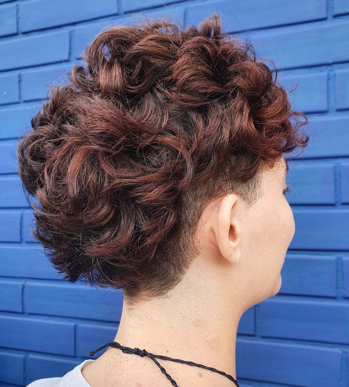 Curly Bow Cut on Brown Hair with Red highlights