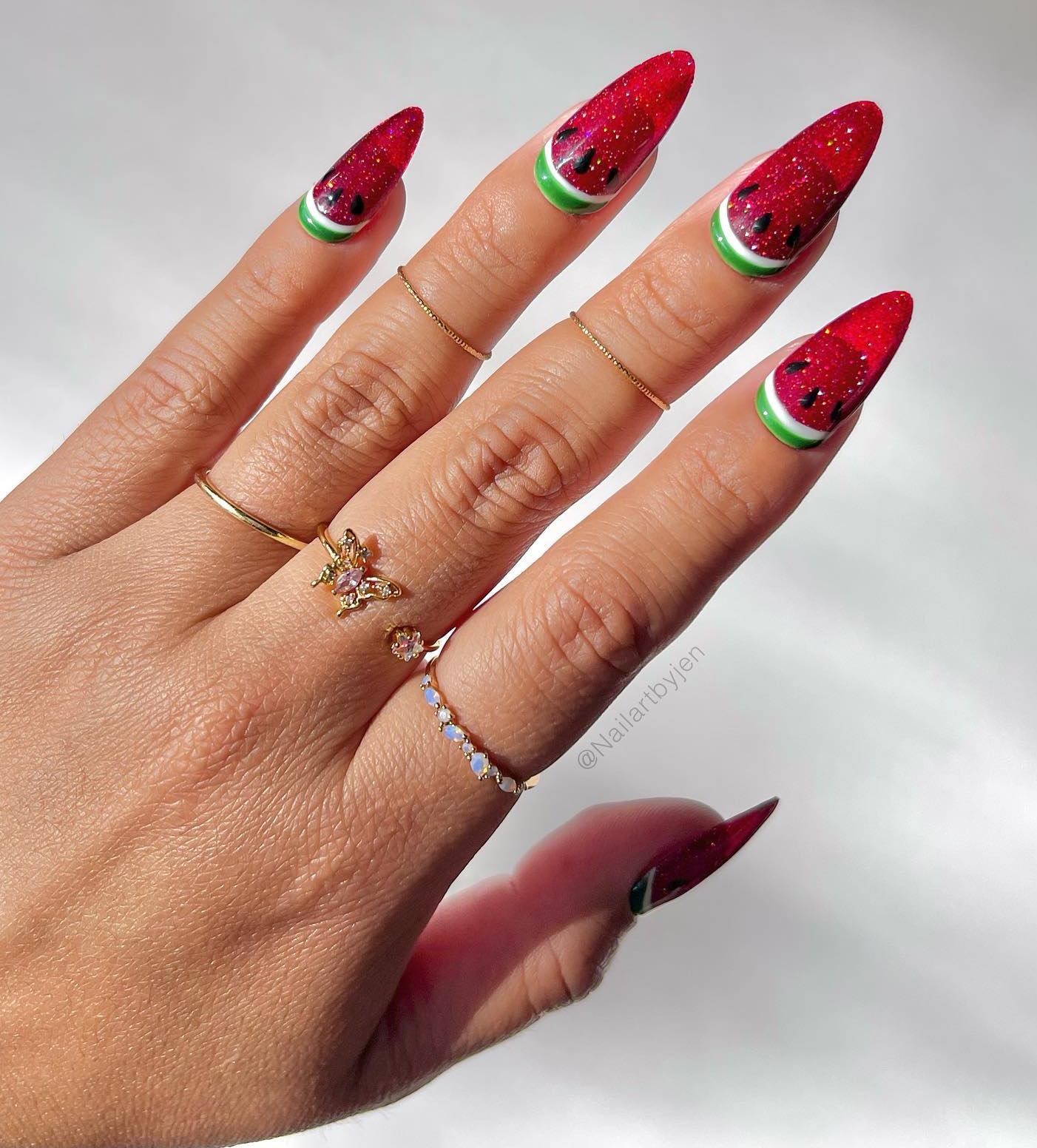 Acrylic Red Watermelon Nails with Cat Eye Effect